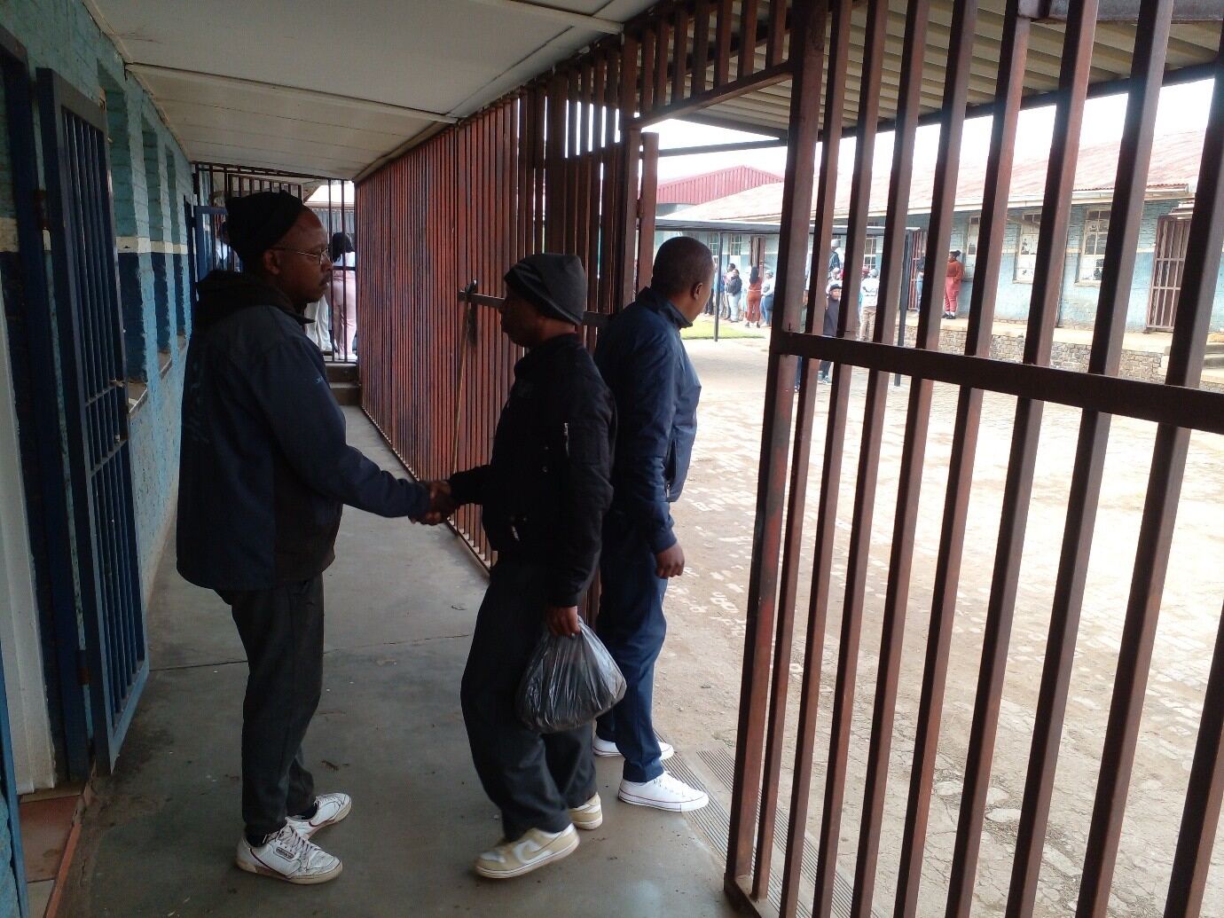 Two community partners shaking hands at the centre