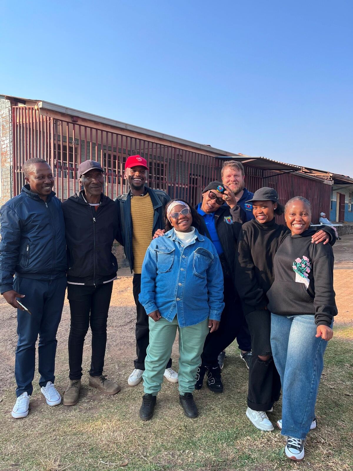 Team members outside the Breaking Chains Community Centre